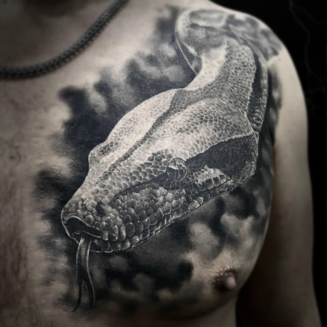 Untitled Igor Vtoroff | Realistic snake chest tattoo with detailed scales. Black and grey realism artwork, Torrevieja, Alicante, Spain.