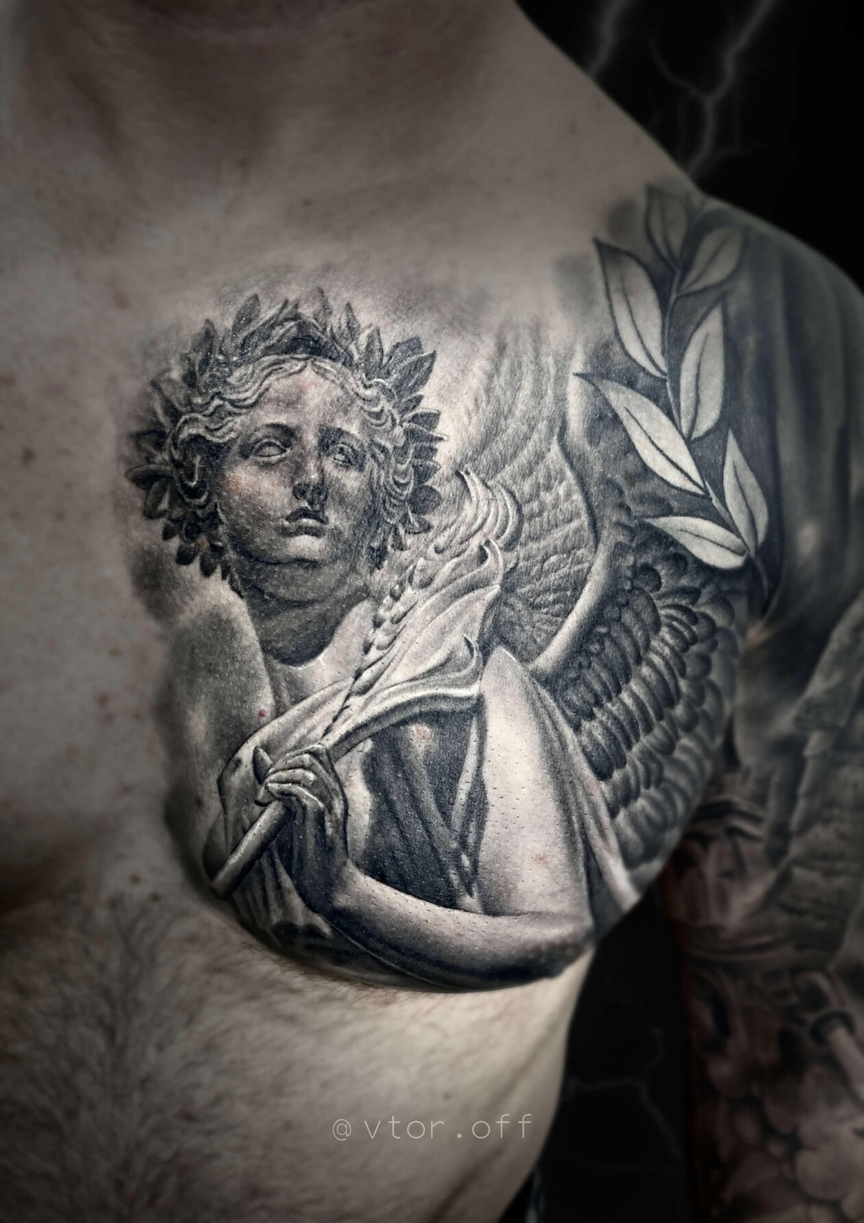 Untitled Igor Vtoroff | Realistic angel statue chest tattoo with laurel branch. Chicano and classical realism, Torrevieja, Alicante, Spain.