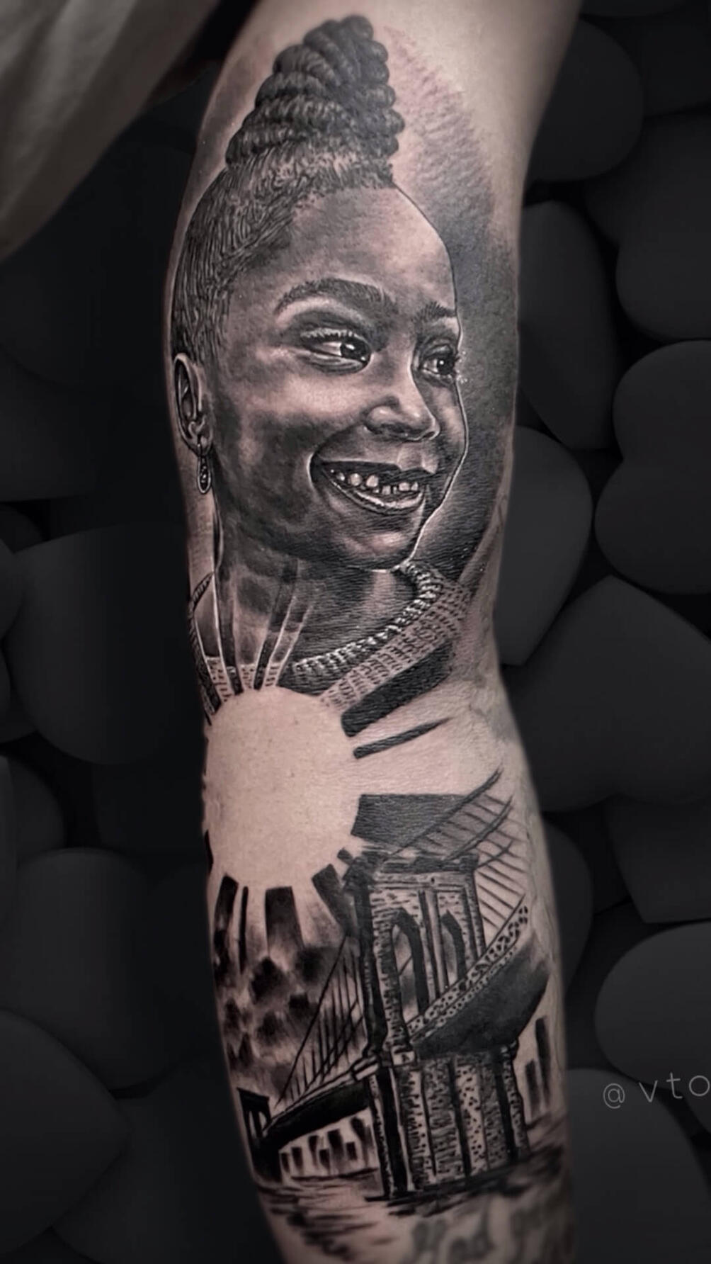 Untitled Igor Vtoroff | Realistic child portrait tattoo with Brooklyn Bridge and sun background. Personal design. Custom black and grey realism, Torrevieja, Alicante, Spain.