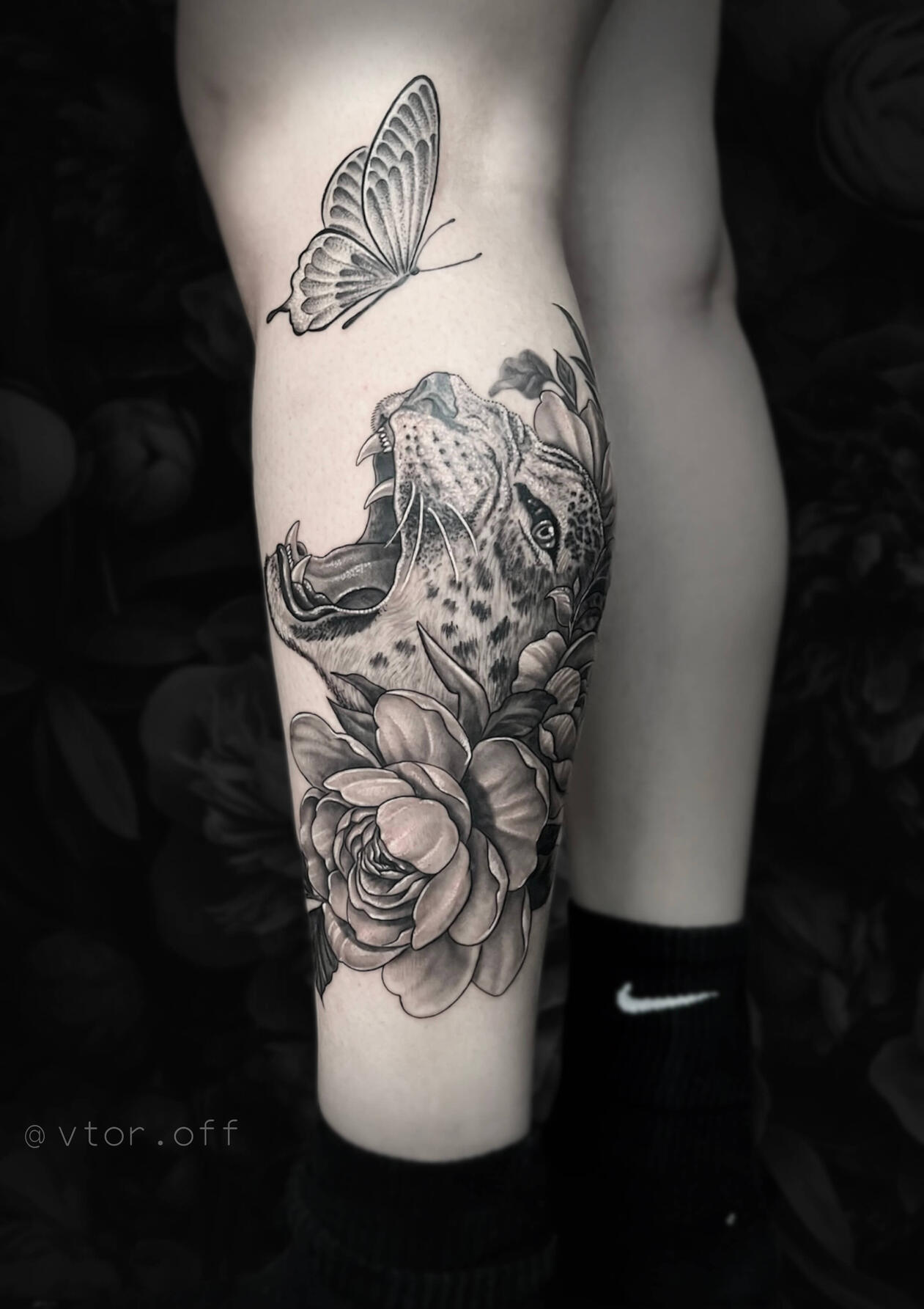 Untitled Detailed roaring leopard tattoo with peonies and butterfly on calf done by Igor Vtoroff. Realistic black and grey floral animal artwork, Torrevieja, Alicante, Spain. Peony tattoo.
