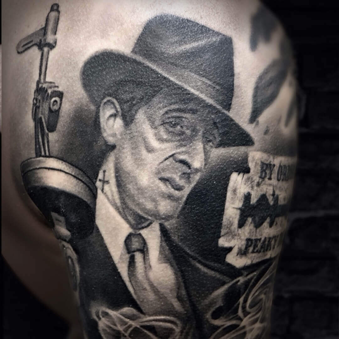 Untitled Custom Al Pacino as Godfather portrait tattoo blended with Peaky Blinders elements done by Igor Vtoroff. Detailed Chicano realism with Tommy gun and razor blade, Torrevieja, Alicante, Spain.