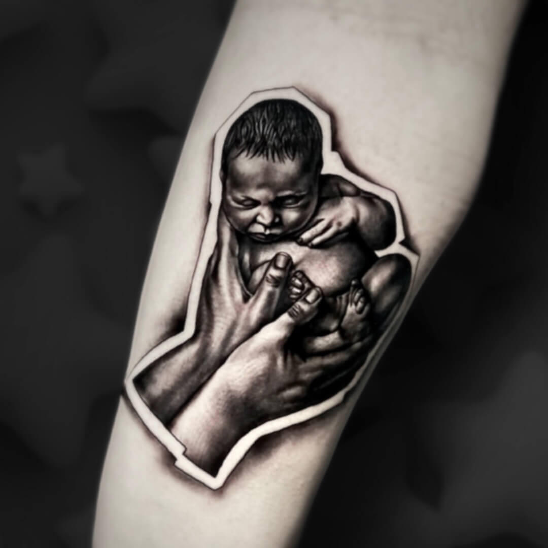 Untitled Igor Vtoroff | Custom newborn baby in hands sticker tattoo style. Realistic black and grey micro-realism, Torrevieja, Alicante, Spain.